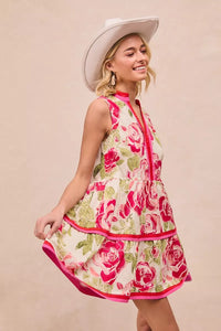 Model wearing BiBi Floral Woven Contrast Edge Tiered Ruffle Mini Dress in a summer garden setting