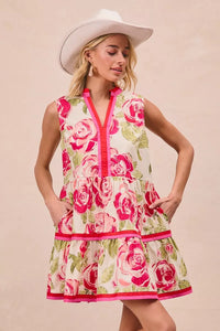 Model wearing BiBi Floral Woven Contrast Edge Tiered Ruffle Mini Dress in a summer garden setting