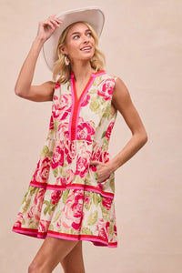 Model wearing BiBi Floral Woven Contrast Edge Tiered Ruffle Mini Dress in a summer garden setting