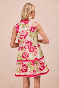Model wearing BiBi Floral Woven Contrast Edge Tiered Ruffle Mini Dress in a summer garden setting