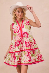 Model wearing BiBi Floral Woven Contrast Edge Tiered Ruffle Mini Dress in a summer garden setting