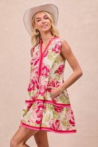 Model wearing BiBi Floral Woven Contrast Edge Tiered Ruffle Mini Dress in a summer garden setting