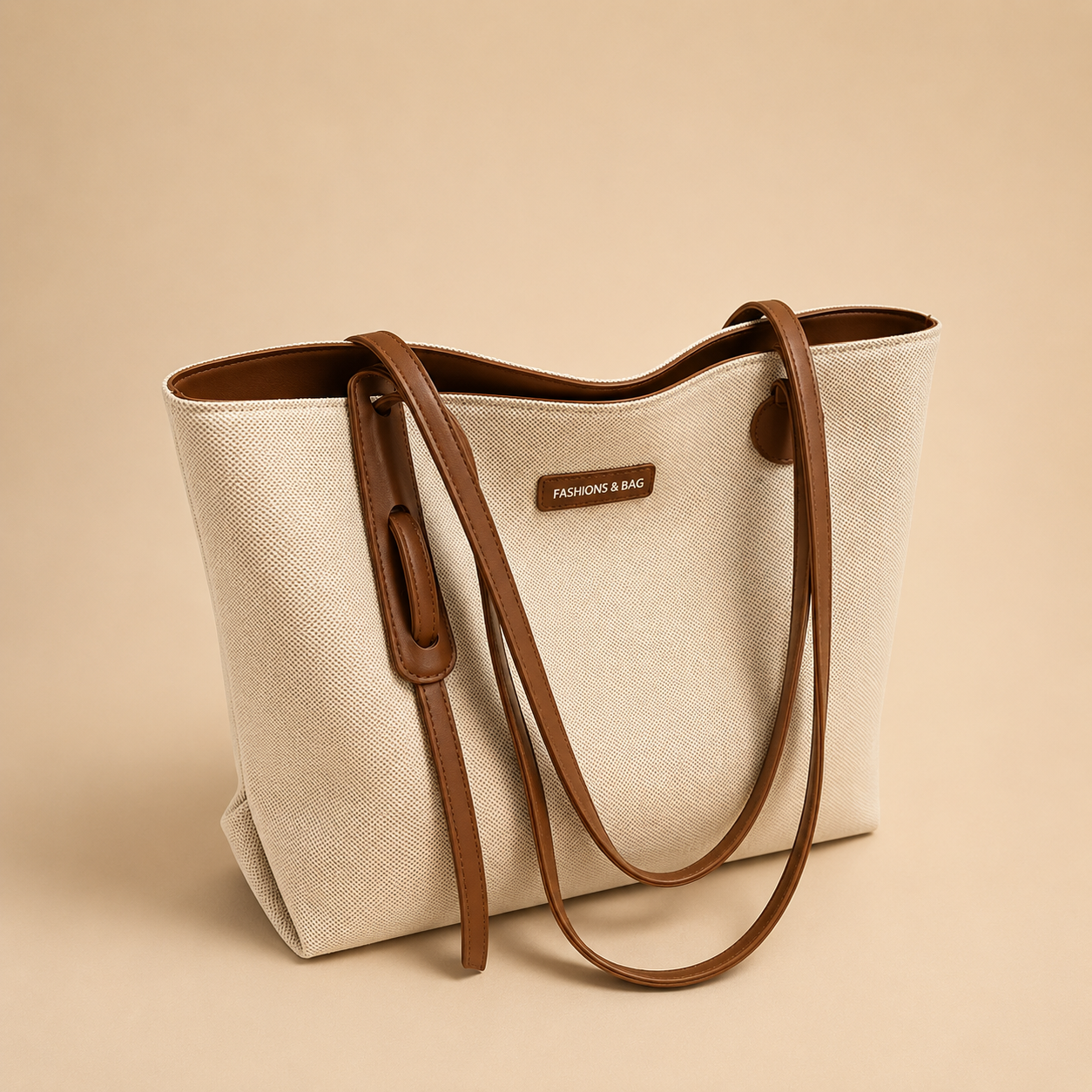 A person shown from the back wearing a black sweater and white pants, carrying a large off-white canvas tote bag with brown leather handles and trim against a plain beige background.