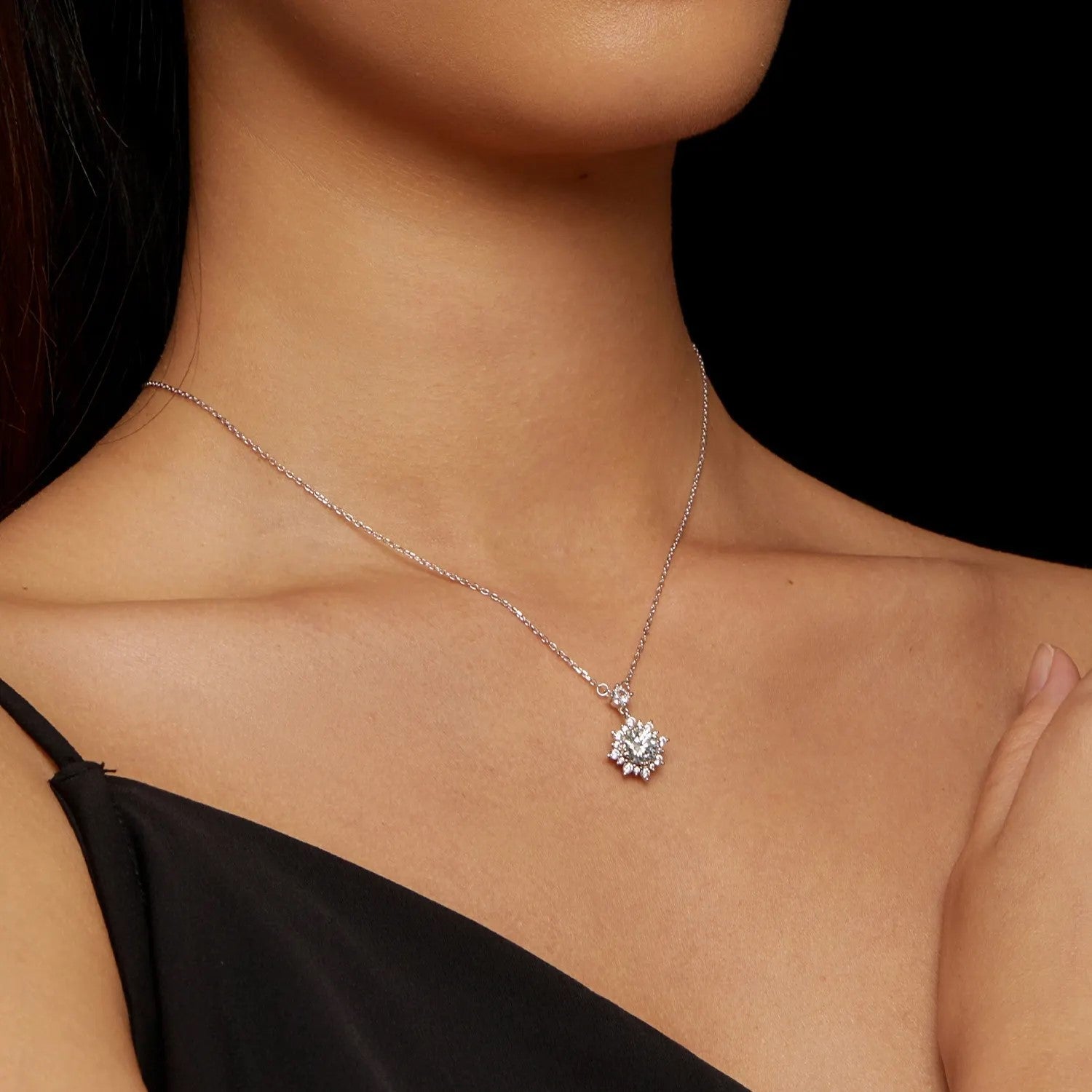 Model wearing the rhodium plated silver snowflake necklace to show scale and length