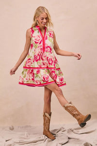 Model wearing BiBi Floral Woven Contrast Edge Tiered Ruffle Mini Dress in a summer garden setting